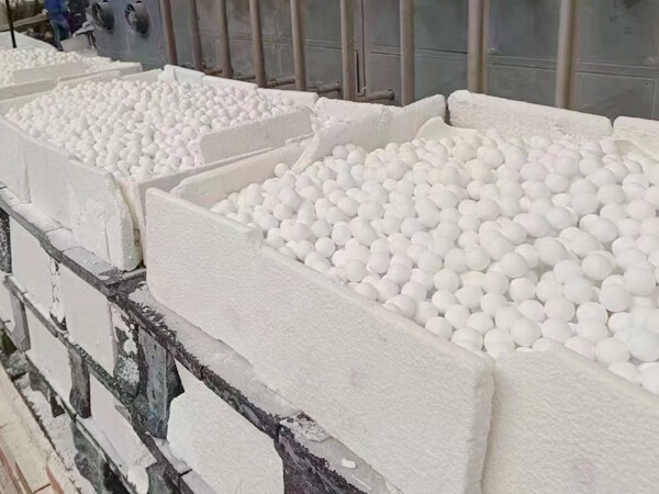 Ceramic balls in regenerative burner system